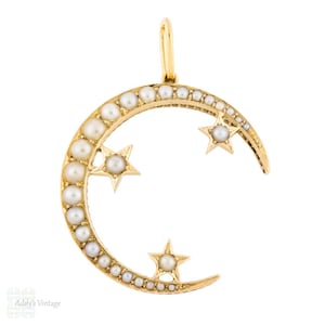 Colgante antiguo de oro de 15 quilates con luna creciente y estrella celestial.