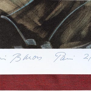May include: An art print showing a golf club and part of a golf bag. The print is signed and dated 2/4/86. The artwork is framed with a white border and a red mount.