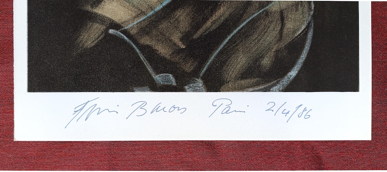 May include: An art print showing a golf club and part of a golf bag. The print is signed and dated 2/4/86. The artwork is framed with a white border and a red mount.