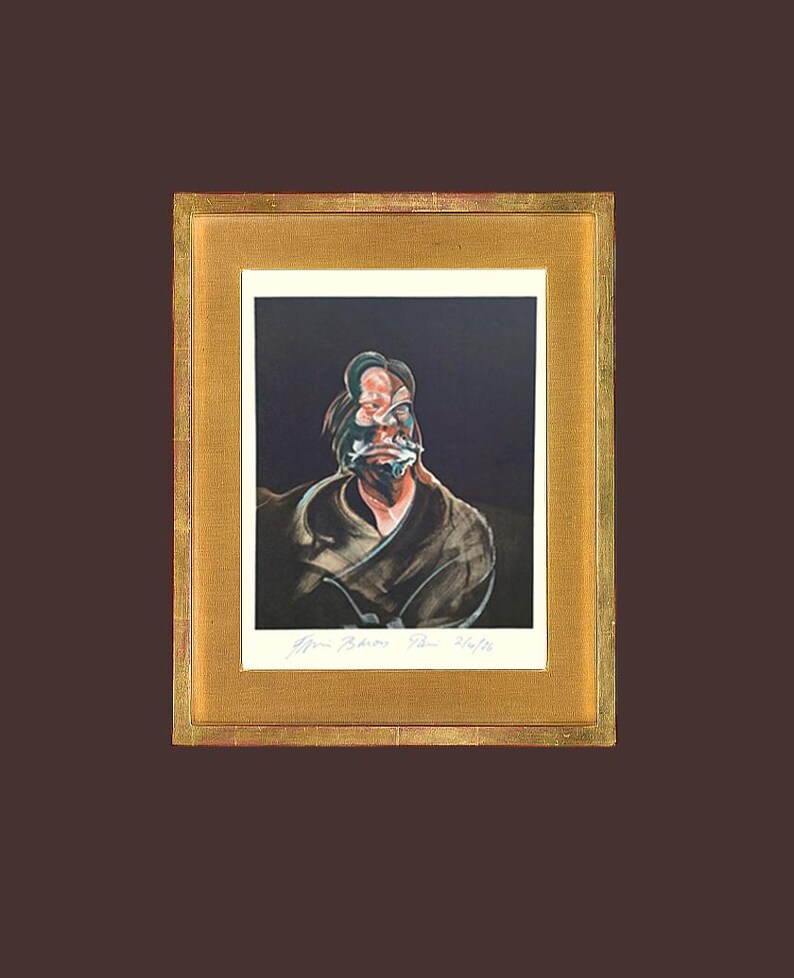 May include: A framed portrait with a dark background, featuring a distorted face. The artwork is signed and presented in a gold-coloured frame, offering a classic aesthetic.