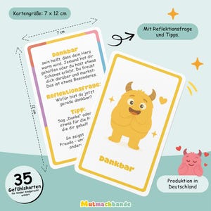 May include: Two cards with rounded corners, each 7 cm x 12 cm, featuring the word "Dankbar" and a cartoon monster. One card has text in German. The cards are yellow and white with a cartoon illustration. The set includes 35 feeling cards for children.