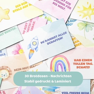 Könnte beinhalten: Eine Sammlung farbenfroher Karten mit verschiedenen Aquarellillustrationen und Text. Die Karten zeigen Bilder einer Rakete, eines Regenbogens, eines Sterns und anderer Designs. Der Text auf den Karten enthält Sätze wie "Du kannst alles schaffen!"