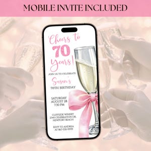 May include: A smartphone displaying a digital invitation for a 70th birthday celebration. The invitation features text that reads "Cheers to 70 Years!" and includes details such as the date, time, and location: Cliffside Winery, Newport Beach.