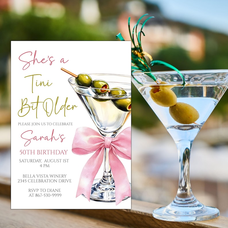 May include: A birthday invitation and a martini glass with olives. The invitation reads "She's a Tini Bit Older" and includes details for Sarah's 50th birthday celebration, with a pink bow illustration.