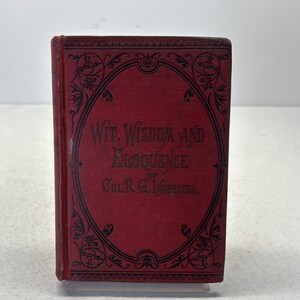May include: A vintage book with a red cover and black decorative frame. The title "Wit, Wisdom and Eloquence" is displayed in white text. The author's name, Col. R.G. Ingersoll, is also visible. The book is in good condition.