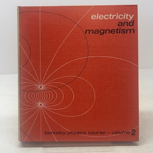 May include: A hardbound textbook titled Electricity and Magnetism, Berkeley Physics Course - Volume 2. The cover is a solid orange with thin white lines depicting magnetic field patterns and black text in the upper right and bottom.
