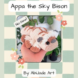 Może przedstawiać: Okładka wzoru na szydełko przedstawiająca pluszowego Appa, Niebiańskiego Bizona. Wzór oznaczony jest jako "Bez szycia!" i zawiera tekst "By AbiJade Art" oraz uchwyt Instagram "@abijade_art". Tło ma wzór w szachownicę.