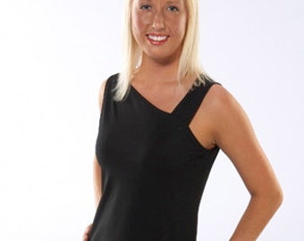 May include: A woman with blonde hair is wearing a black sleeveless top with a unique asymmetrical design and a black skirt.