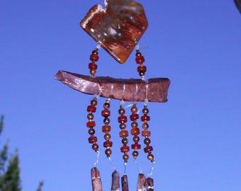 Atrapasol en forma de ave del paraíso