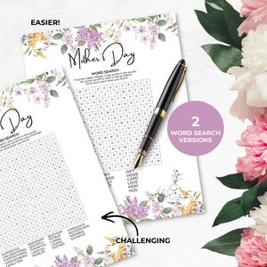 May include: Two Mother's Day word search puzzles with floral accents and the text "Mother's Day". One puzzle is labelled "Easier!" and the other "Challenging". A black and gold pen rests on the puzzles. A pink and white flower arrangement is in the background.