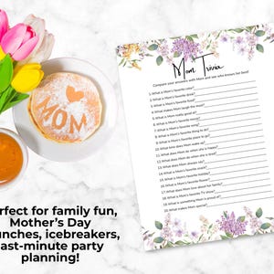 May include: A Mother's Day brunch scene with pancakes dusted with powdered sugar spelling "MOM" and a heart, a cup of orange juice, and a "Mom Trivia" game sheet with floral accents. Tulips add colour.