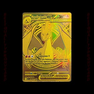 Könnte beinhalten: Goldfarbene Mega Charizard Y EX Pokémon-Karte. Die Karte zeigt eine detaillierte Illustration von Charizard mit 360 KP und dem Text "Explosion Y". Die Karte stammt aus dem XY Evolutions-Set, Kartennummer 294/217.