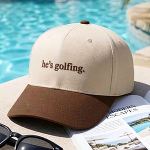 He's Golfing Embroidered Trucker Cap, Cotton Golf Hat, Golfer Gift