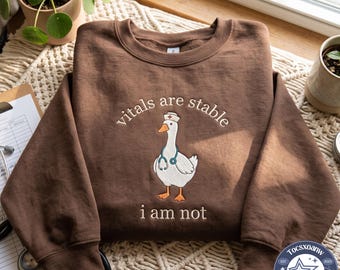 Embroidered Vitals Are Stable I Am Not Doctor Goose Sweatshirt, ER Nurse Cuff em