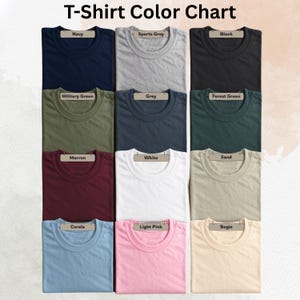 May include: A color chart displaying various t-shirt colors. The chart includes colors such as navy, sports grey, black, military green, grey, forest green, maroon, white, sand, corola, light pink, and begie. The text "T-Shirt Color Chart" is at the top.