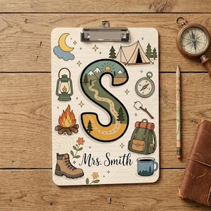 May include: A clipboard featuring a large letter S filled with a mountain landscape illustration. Surrounding the letter are camping-themed icons including a tent, campfire, lantern, compass, backpack, hiking boot, and mug. The text Mrs. Smith is printed below the letter.
