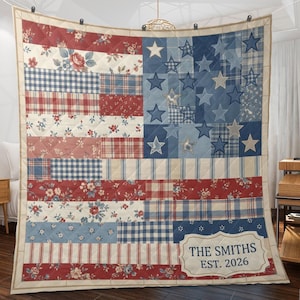 May include: A quilted blanket featuring a patchwork design of the American flag in red, white, and blue. The pattern includes floral prints, gingham, and plaid fabrics. A white rectangular label in the bottom right corner reads THE SMITHS EST. 2026.