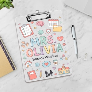May include: A clipboard with a silver clip and a light gray background. The clipboard is decorated with colorful illustrations and the text "MRS. OLIVIA Social Worker". The design includes a brain, calendar, heart, and other social work-related icons.