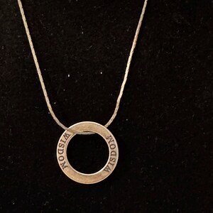 Wisdom Charm on complimentary silver chain.