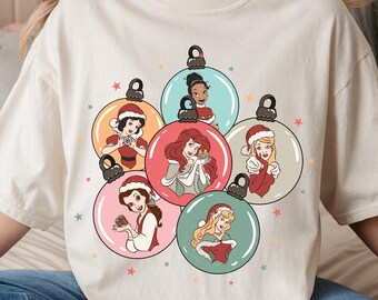 Comfort Color® Disney Christmas Princess Coquette Shirt, Coquette Disney Trip, Snow Globe Rapunzel Tiana Ariel Snow White Anna Elsa Princess