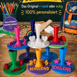 Könnte beinhalten: Eine Sammlung bunter, personalisierter 3D-gedruckter Stiftehalter mit runden oder eckigen Sockeln. Jeder Halter trägt Namen wie Leni, Tiara, Niklas, Jaro, Frieda und Emma sowie dekorative Formen wie Sterne, Herzen und Autos.