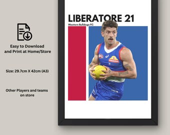 May include: Framed print featuring a football player in a blue and white uniform, holding a yellow ball. The print includes the name "LIBERATORE 21" and the team name. The background has red and blue sections. The print size is 29.7cm x 42cm.