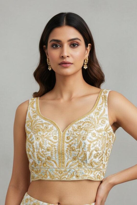 White blouse with gold embroidery