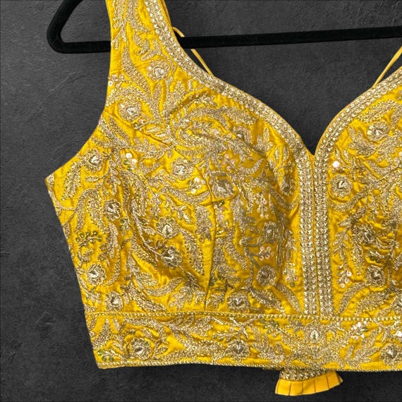 Yellow blouse with gold embroidery
