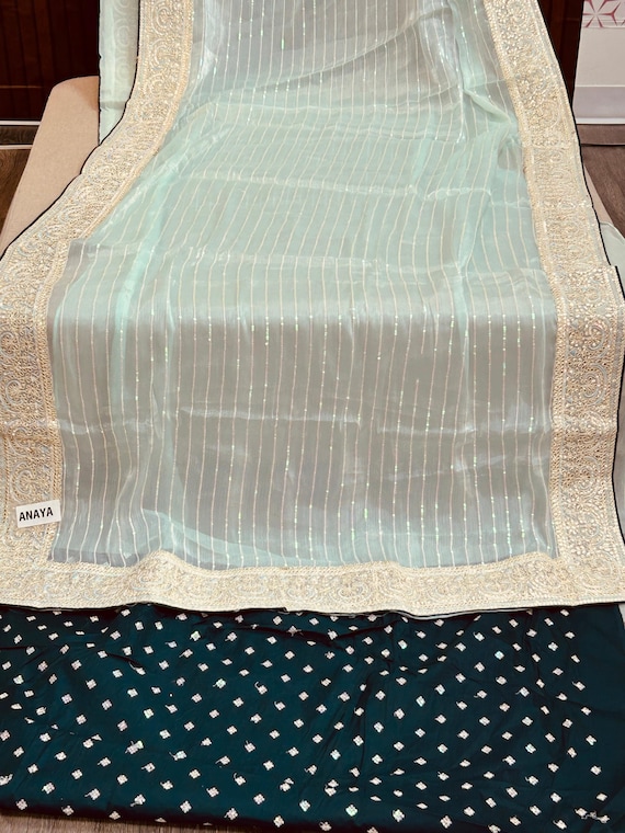 Tissue silk saree with contrast blouse piece