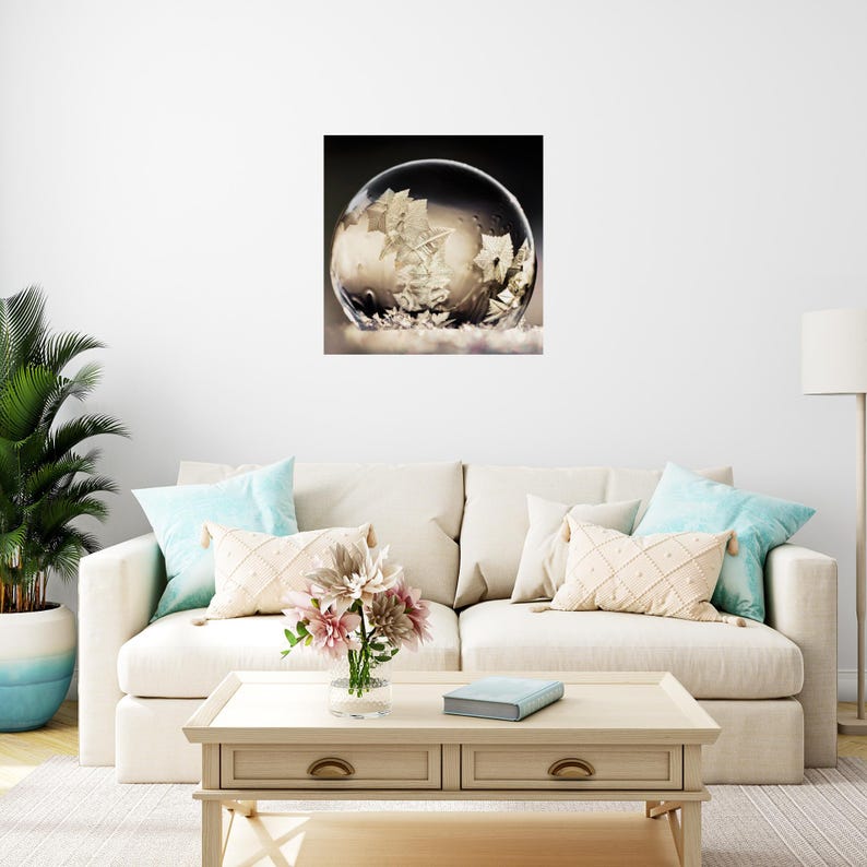 May include: A framed print featuring a detailed image of a ship inside a clear bubble. The ship is white and appears to be sailing on a sea of clouds. The bubble is set against a dark background.