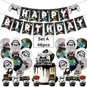 May include: A gaming-themed party decoration set including a Happy Birthday banner with controller graphics, forty-six balloons featuring gamer motifs, and cake toppers. The set includes text reading Set A 46pcs and Happy Birthday on the cake topper.