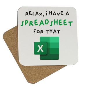 May include: A white square coaster with the text "Relax, I have a spreadsheet for that" in black and green. The Microsoft Excel logo is displayed below the text. The coaster is on top of a brown square coaster.