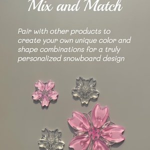 May include: Four flower-shaped snowboard design elements in pink and clear. The text "Mix and Match" and a description of the product are in the image.