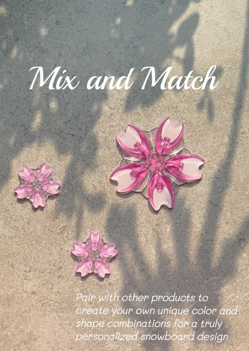 May include: Three pink and white flower-shaped decorations on a textured surface. The text "Mix and Match" is at the top, with additional text below. The decorations are for a personalized snowboard design.
