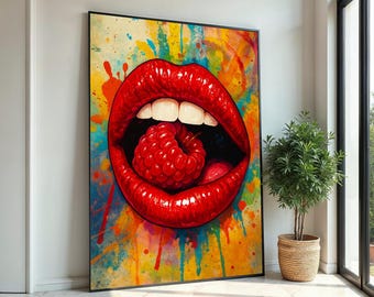 May include: A large framed art print featuring a close-up of red lips with a raspberry inside. The artwork has a vibrant, colorful background with paint splatters in yellow, blue, and orange. The lips are glossy and detailed, with bright white teeth.