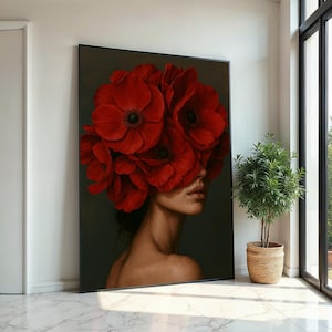 May include: A woman's face is partially obscured by a large bouquet of red poppies. The flowers are arranged in a way that covers her eyes and forehead, leaving only her nose, mouth, and chin visible. The woman has dark hair and a light complexion. The background is a dark, solid colour.