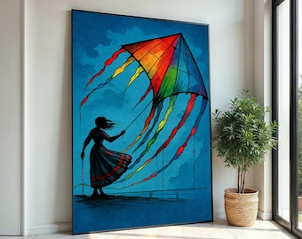 May include: A framed art print depicts a person flying a colorful kite against a blue sky. The kite is a vibrant rainbow of colors, and the person is a silhouette in a flowing dress. The artwork is displayed in a bright, modern room.