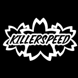 May include: White graphic design with the text "KILLERSPEED" in a bold, stylized font. The text is surrounded by three white stylized flower shapes.