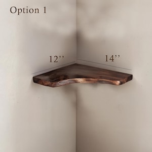 May include: A wooden corner shelf with a natural wood finish. The shelf is 12 inches wide and 14 inches long. Option 1.