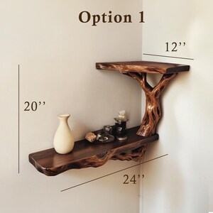 May include: Option 1 corner shelf made of wood with a tree branch design. The shelf is 24 inches wide, 12 inches deep, and 20 inches tall.