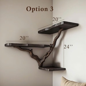 May include: Option 3 corner shelf unit made from natural wood branches with three shelves. The top shelf is 20 inches wide, the middle shelf is 20 inches wide, and the bottom shelf is 24 inches wide.