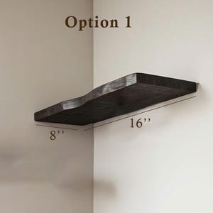 May include: Option 1: A dark brown wooden corner shelf with a wavy edge. The shelf is 16 inches long and 8 inches wide.