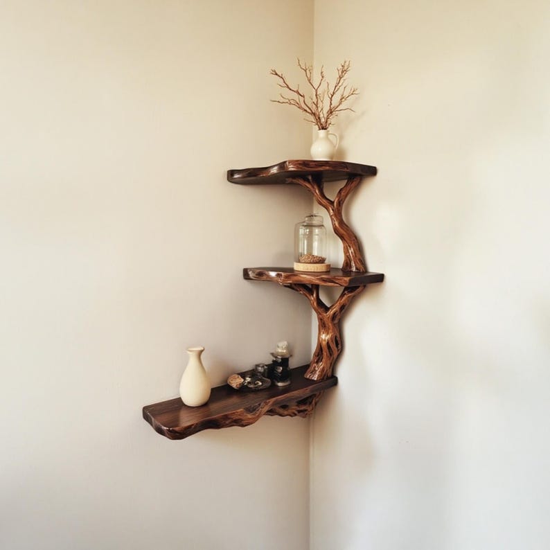 A handcrafted driftwood shelf made from a natural floating tree branch, installed in the corner of a room. This rustic corner shelf showcases the organic texture and weathered charm of real driftwood, offering a unique, eco-friendly storage or display solution. Ideal for coastal, boho, or minimalist decor, the driftwood branch shelf adds character and warmth while maximizing space with its functional, floating corner design.