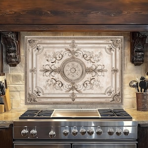 May include: A decorative kitchen backsplash with an ornate, vintage design. The backsplash features a central medallion and floral scrollwork in shades of beige and brown. The kitchen also includes a stainless steel stove and dark wood cabinetry.