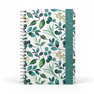 May include: A spiral-bound notebook featuring a white background with a repeating pattern of green and teal watercolor leaves and foliage. A teal stripe runs vertically along the spine. The notebook is designed for writing and note-taking.