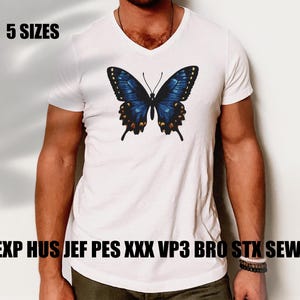 May include: A white V-neck t-shirt featuring a blue butterfly graphic. The shirt has the text "5 SIZES" in black at the top and "EMB EXP HUS JEF PES XXX VP3 BRO STX SEW PCS" in black at the bottom.