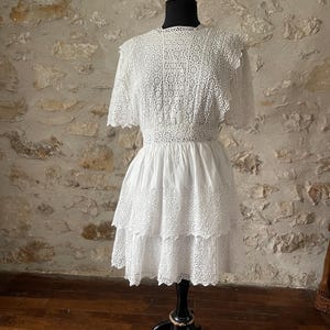 Old white lace dress with ruffles