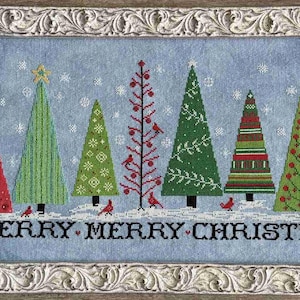 May include: A framed cross-stitch depicting a winter scene with stylised Christmas trees in red, green, and white. The trees are decorated with stars and ornaments, with red birds perched below. The text "MERRY MERRY CHRISTMAS" is stitched across the bottom.