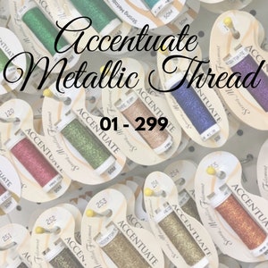 May include: Close-up of a variety of metallic thread spools labeled "Accentuate" with numbers ranging from 01-299. The spools are arranged in a grid pattern and are all the same size.