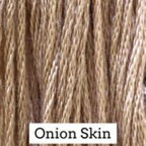 May include: Close-up of natural brown cotton twine, also known as "Onion Skin" twine.